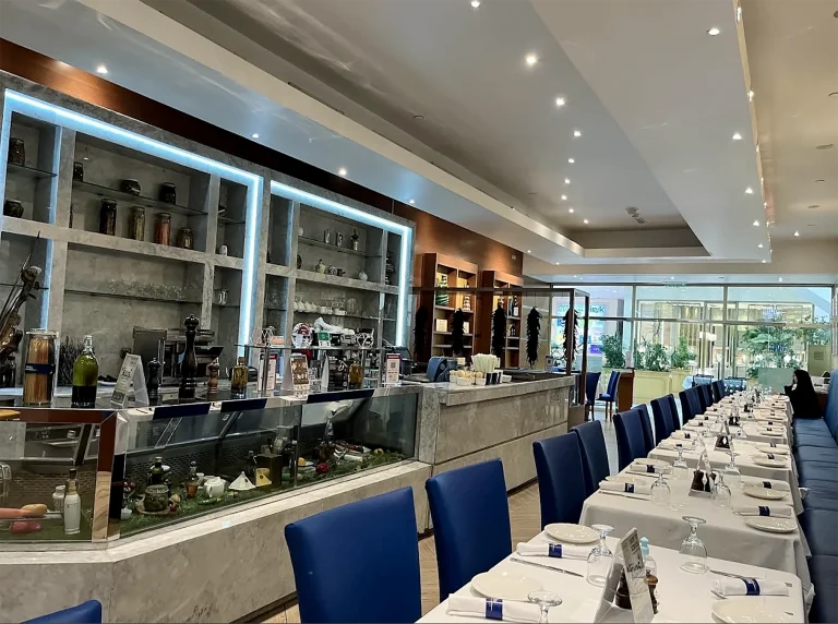 Biella Café and Ristorante, dining hall with blue upholstered chairs, fit-out by HQI Contracting