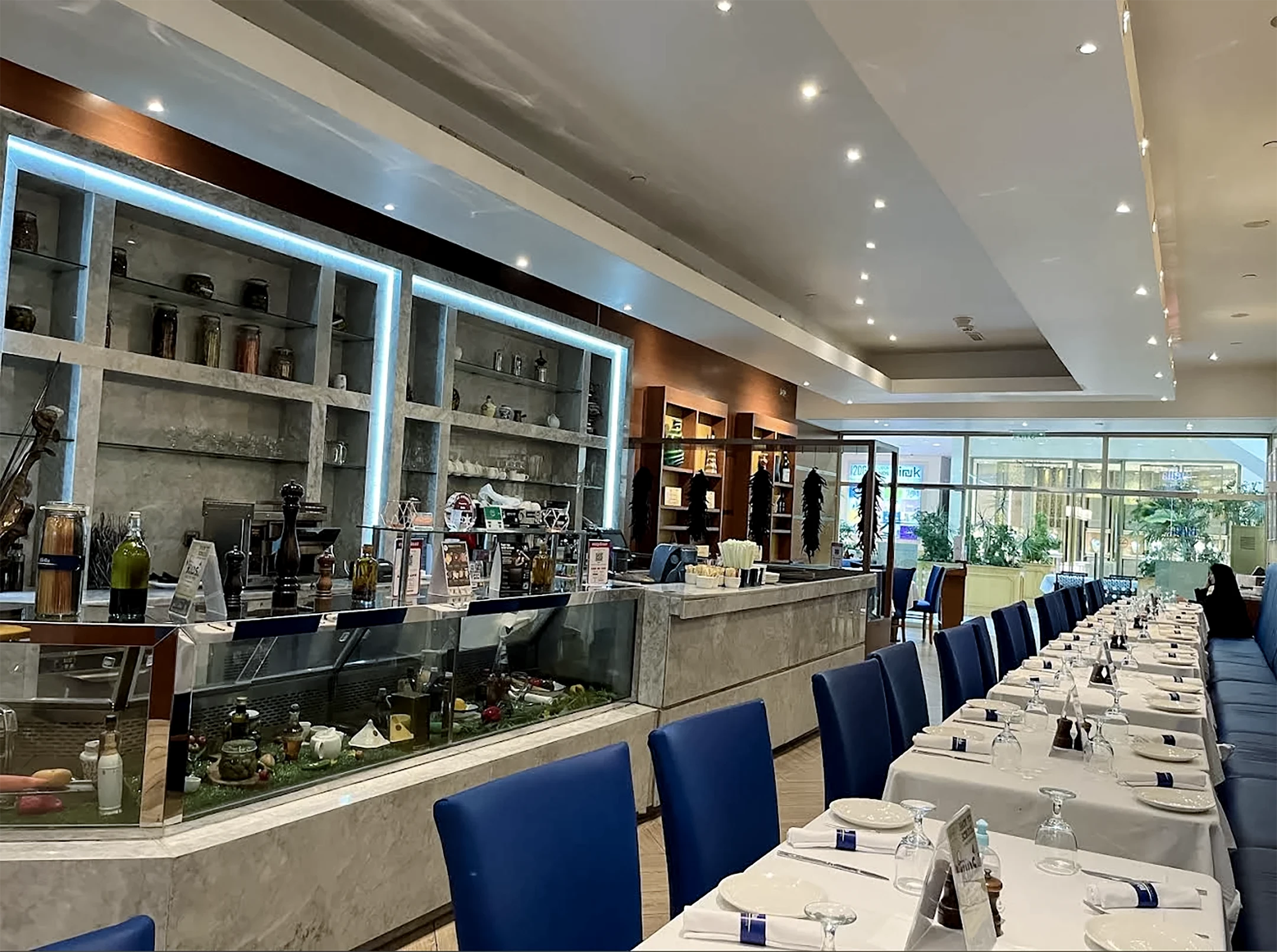Biella Café and Ristorante, dining hall with blue upholstered chairs, fit-out by HQI Contracting